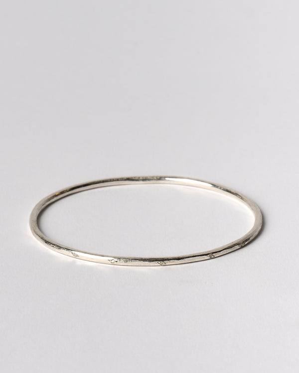 Shimara Carlow —  Hammered Silver Bangle with Scattered Diamonds