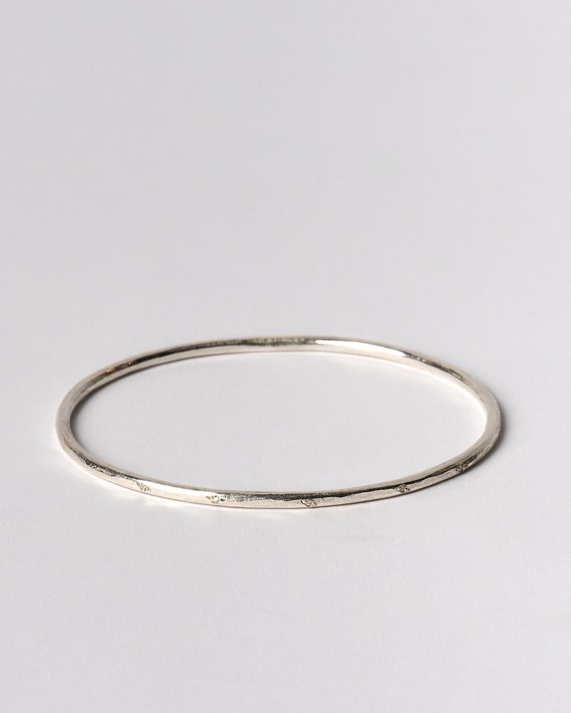 Shimara Carlow —  Hammered Silver Bangle with Scattered Diamonds
