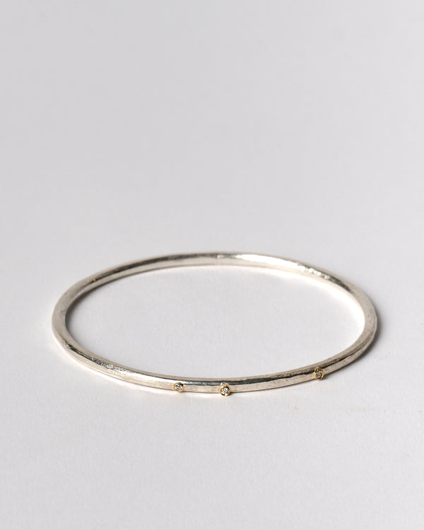 Shimara Carlow —  Hammered Silver Bangle with Diamonds and Gold