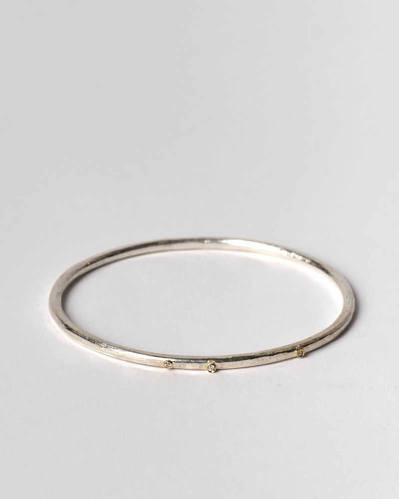 Shimara Carlow —  Hammered Silver Bangle with Diamonds and Gold