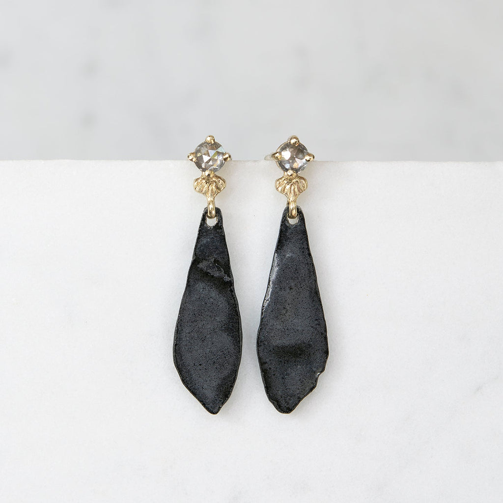Gray stone earrings top